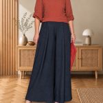 coral red outfit: handmade coral red jo pullover with wide dusky green trousers, a scarlet clutch and olive sandals
